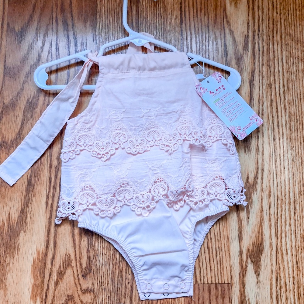 2 matching pink onesies
